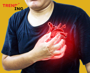 Man clutching chest, showing signs of heart pain or silent heart attack