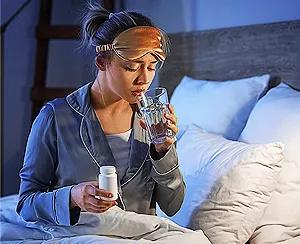 woman-taking-vitamins-for-good-sleep