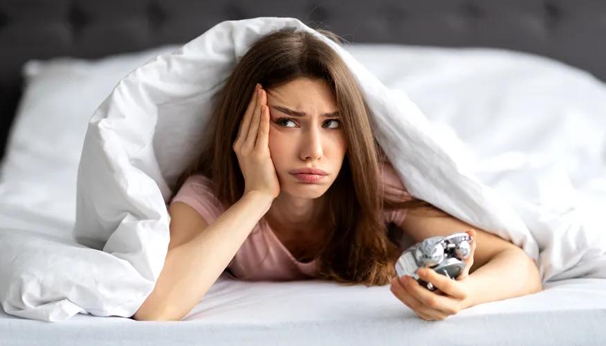 What is defined as oversleeping?