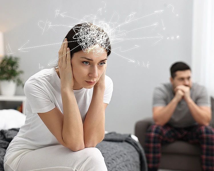 Woman experiencing stress and anxiety with overwhelmed thoughts at home